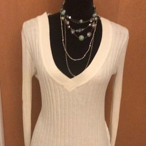 Express size Medium cream fitted sweater .